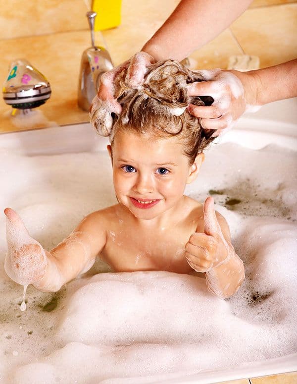 Baby in bath with bubbles